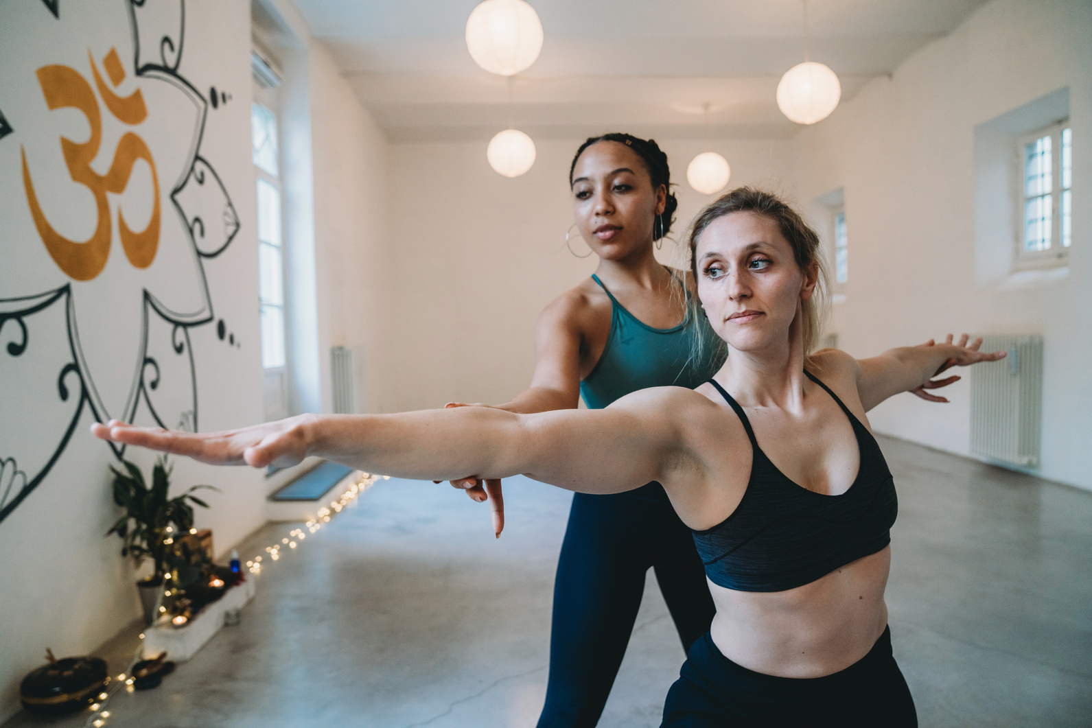 Private yoga lesson of a personal trainer in a yoga studio
